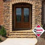 yard-sign-house-1A an EMC security sign in front of a house