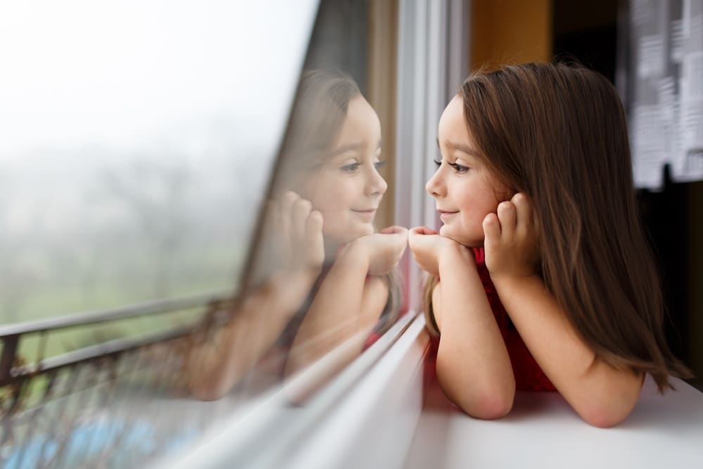 a child looking out her window