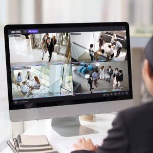 https___assets.avigilon an employee viewing surveillance footage